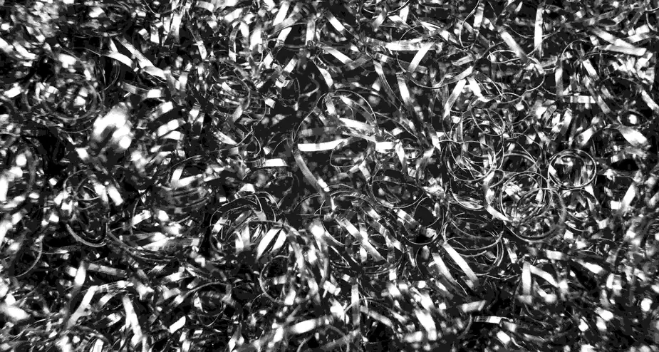 Aluminium scrap surface texture showing metallic material ready for recycling