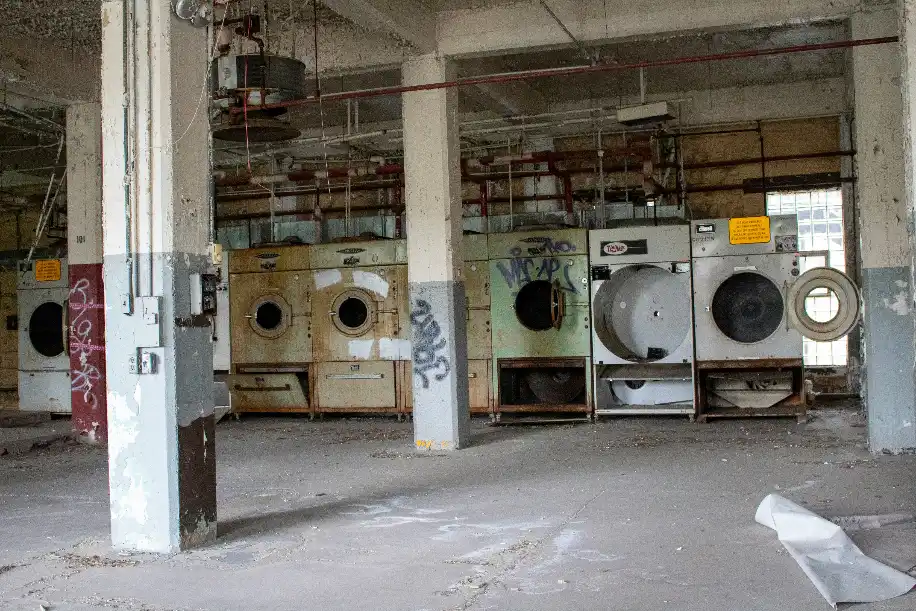 Old washing machine and recyclable appliance materials collected at a Melbourne scrap recycling yard